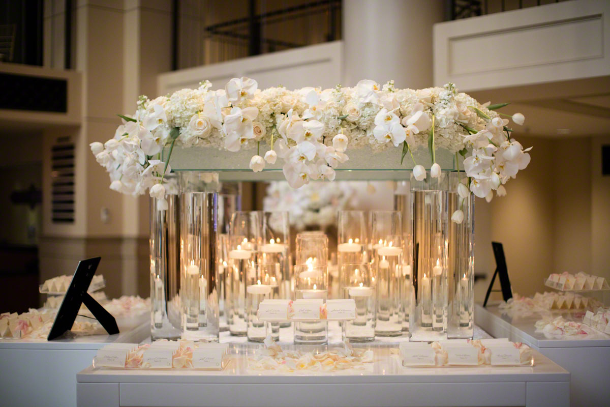 white wedding decor escort card table roses orchids luxury wedding flowers